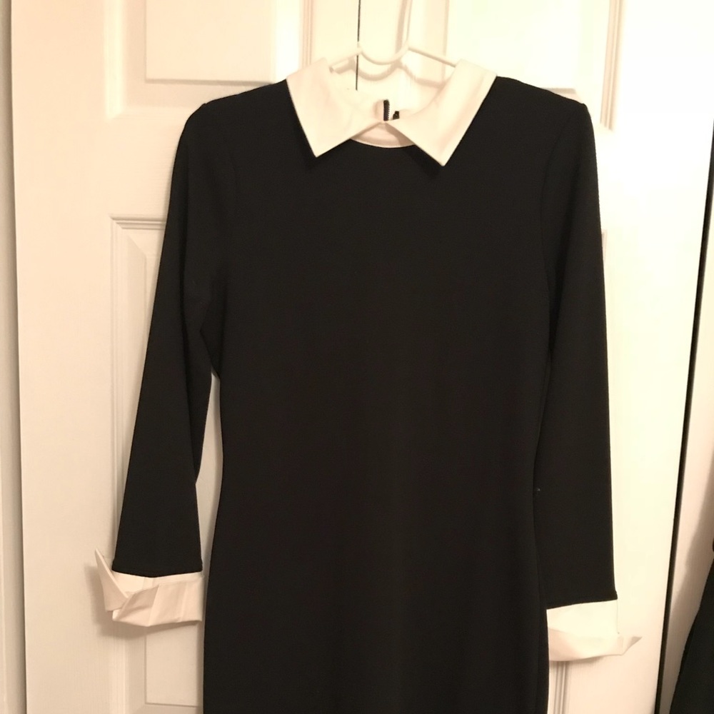 Black and white dress with a zipper on the back.